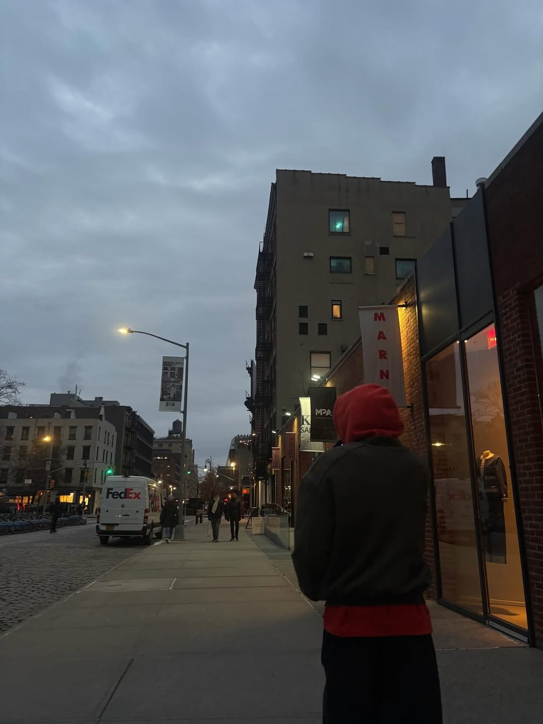 Photo by WOOCHAN • 우찬 on February 13, 2026. May be an image of standing, street and text.