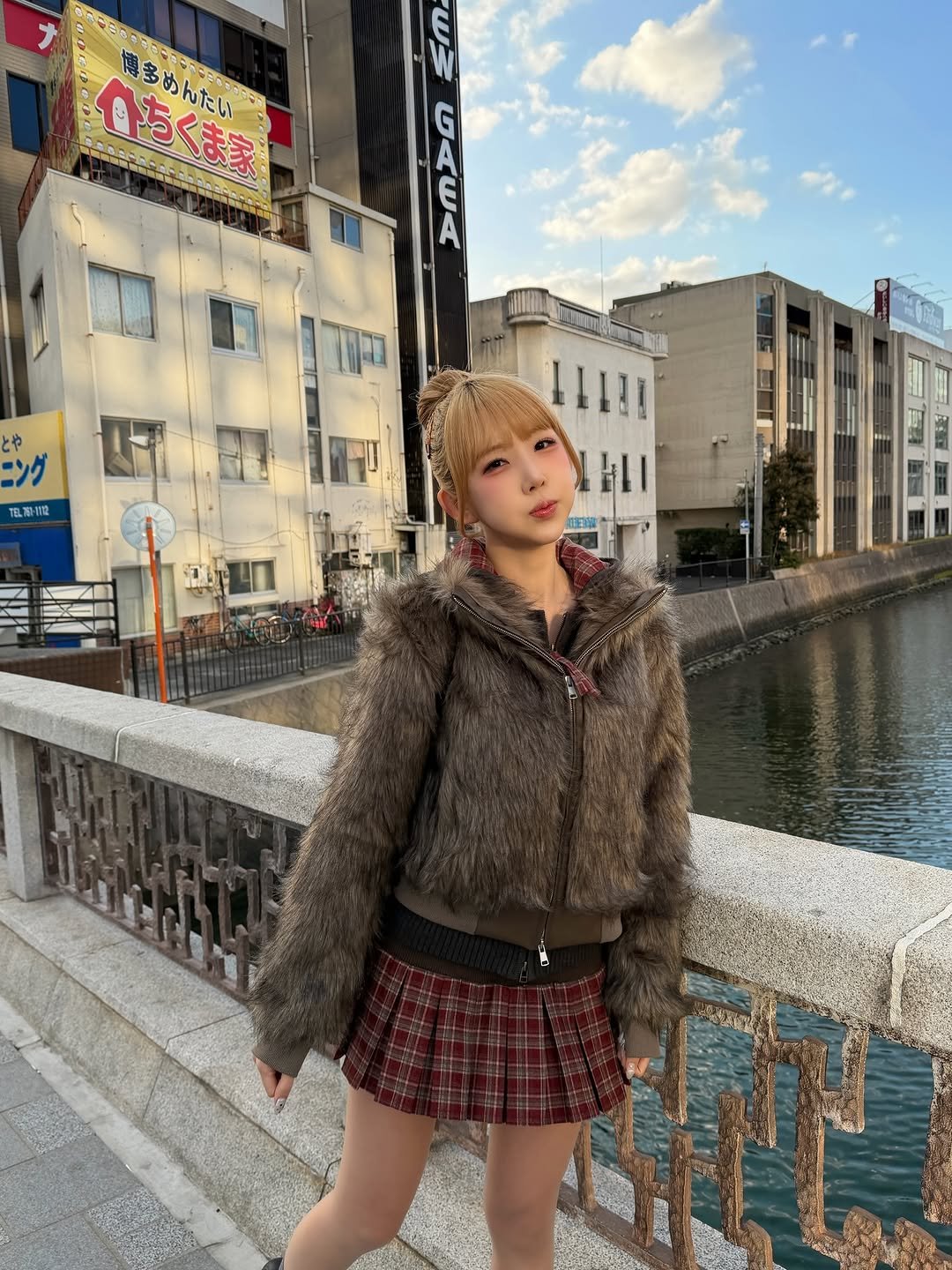 Photo shared by 조이서 Joyseo on January 28, 2026 tagging @rockcake_. May be an image of one or more people, hair, duffle coat, miniskirt, parka, street and text that says 'ら 博多 思まめんたい いちくま家 めんたい 博多めんたい EC w0A오 とや TEL TE.70-TTO 11111'.