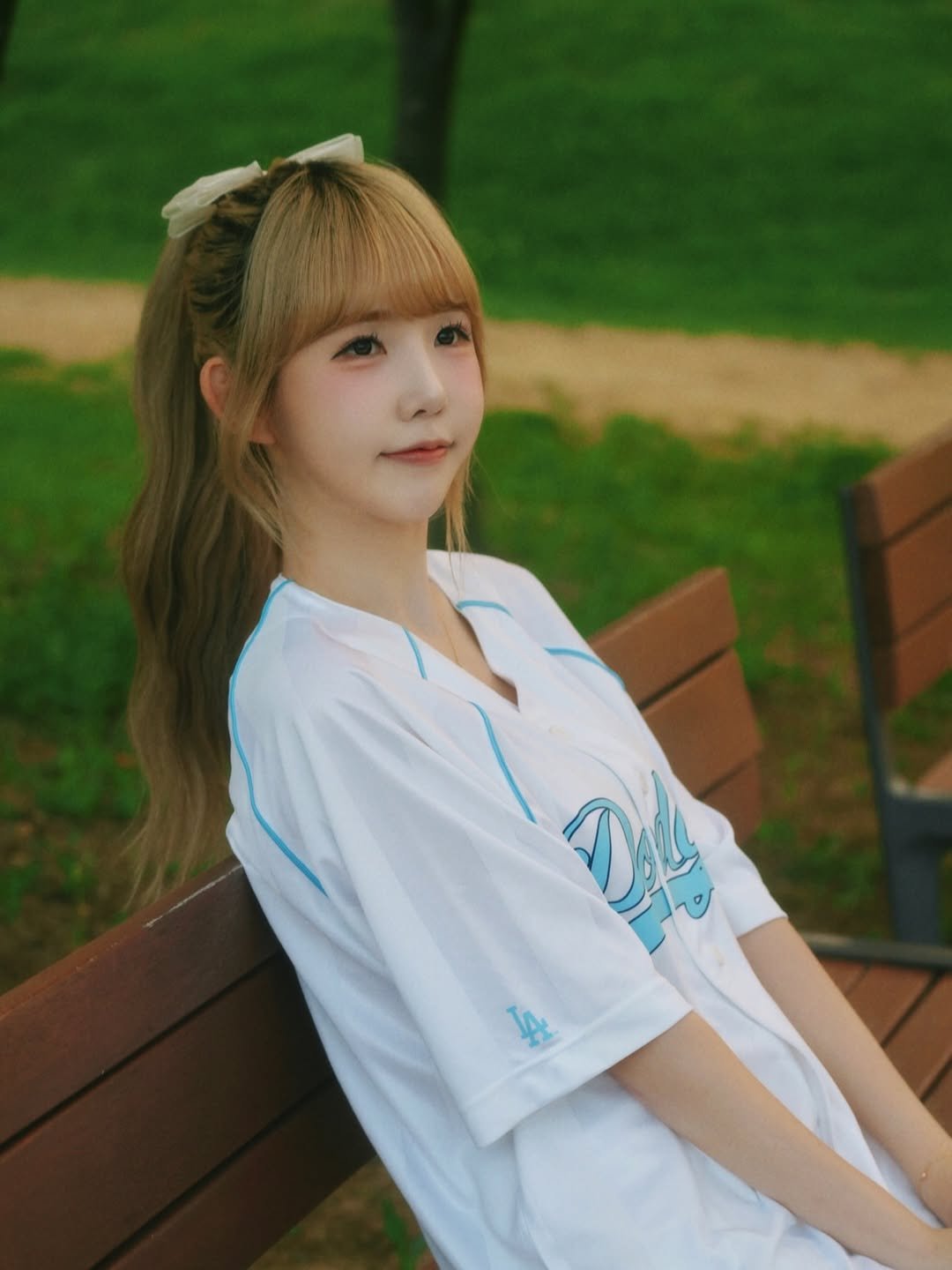 Photo by 조이서 Joyseo on July 20, 2025. May be an image of 1 person, hair, top, outdoors and text.
