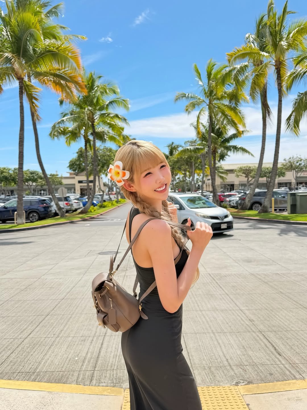 Photo by 조이서 Joyseo on March 09, 2026. May be an image of one or more people, blonde hair, sundress, palm trees and text.