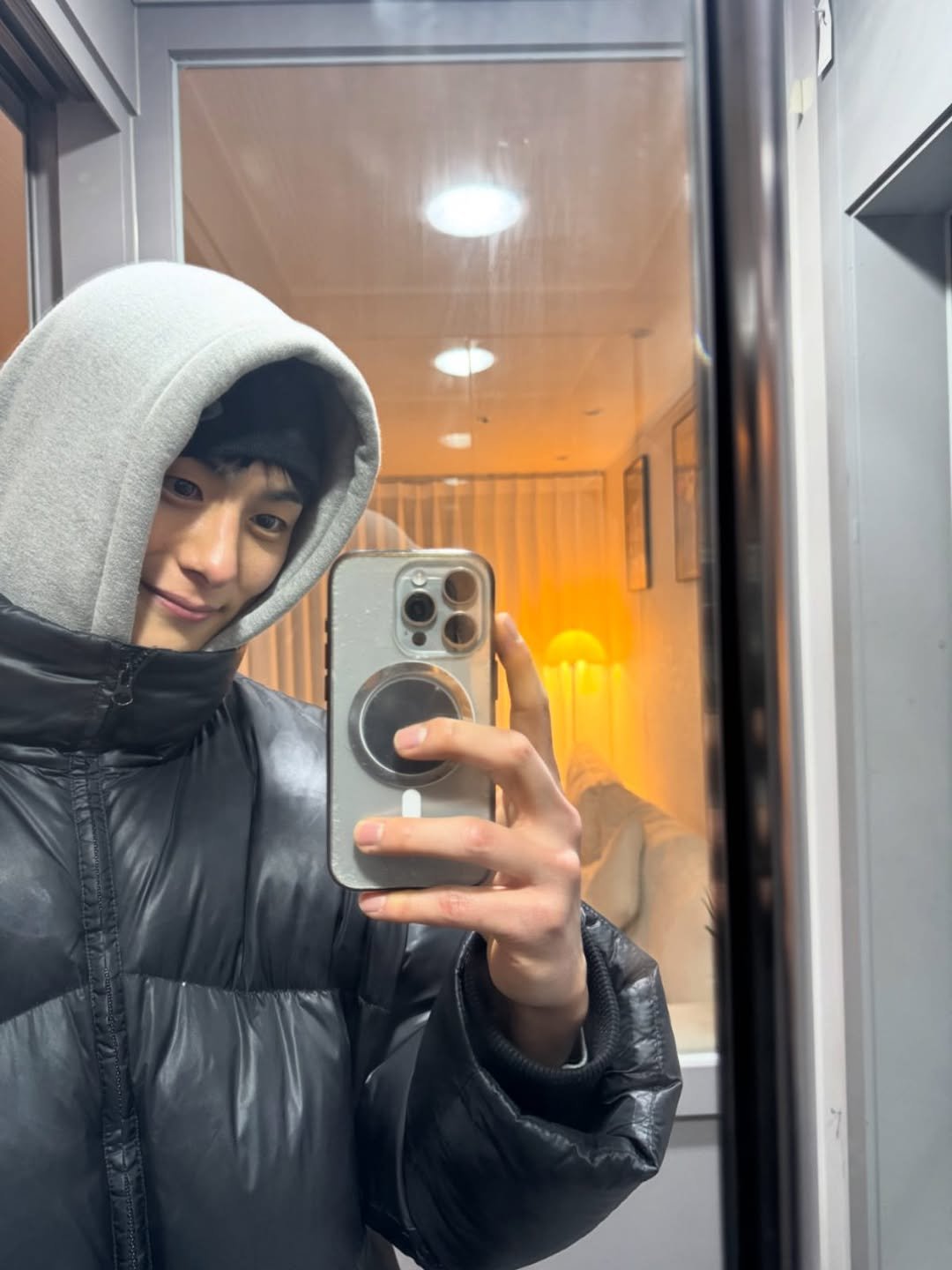Photo shared by 정건주 on January 10, 2026 tagging @sbsnow_insta. May be a selfie of one or more people, bangs, duffle coat, goosedown coat, parka, top and mirror.