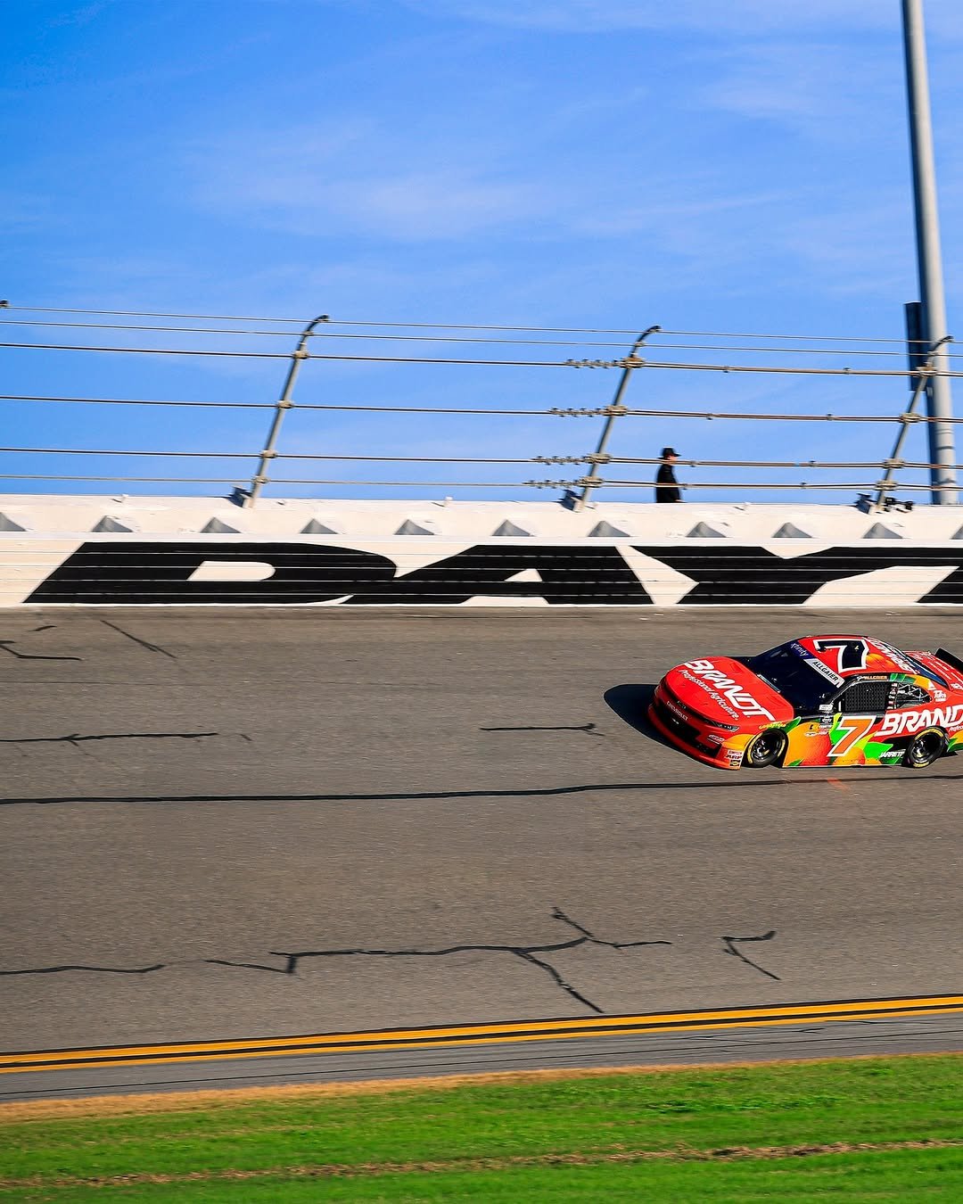 Photo shared by jrmotorsports on January 05, 2026 tagging @j_allgaier, @daytona, and @brandtracing. May be an image of parachute, road, curb and text.