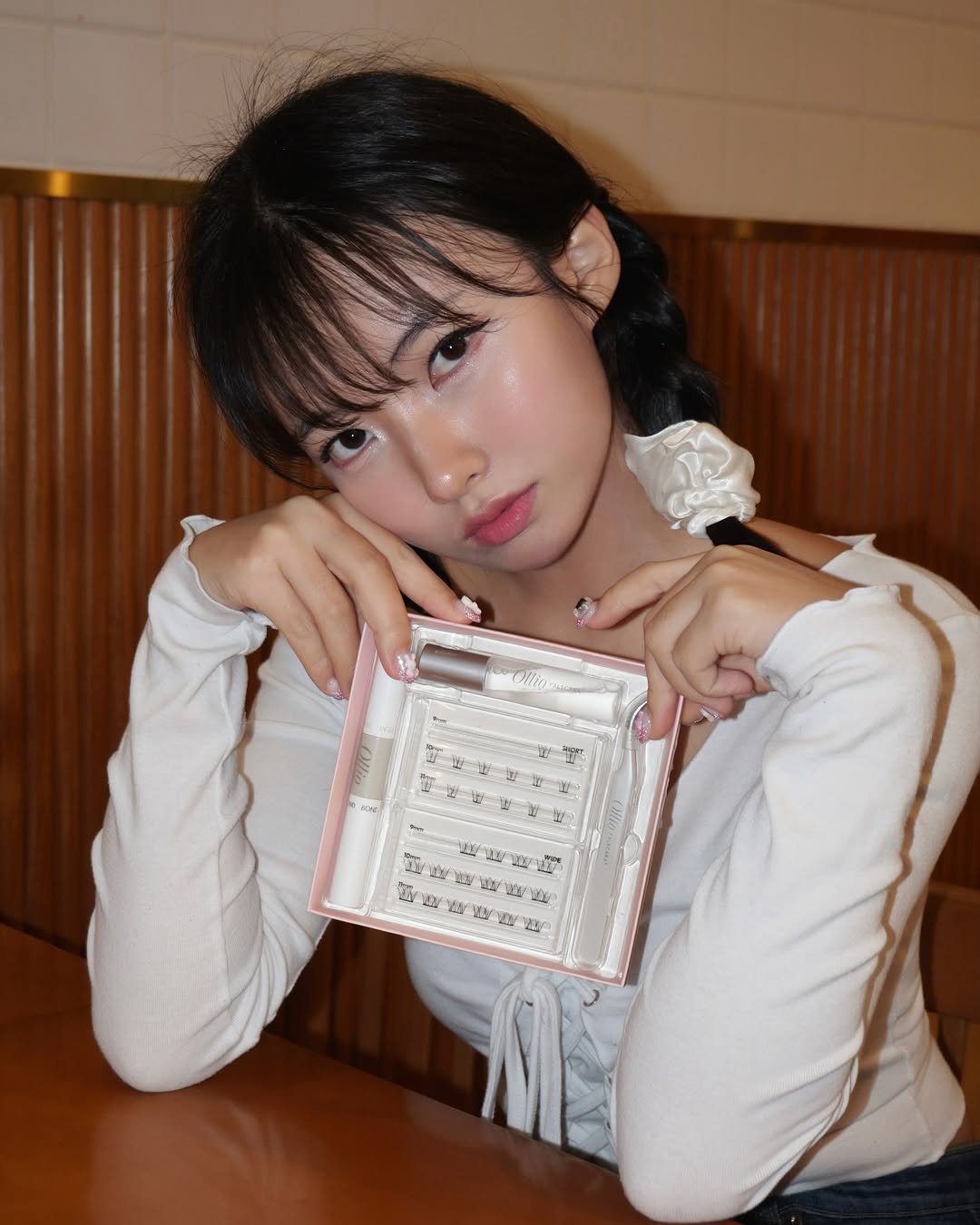 Photo shared by 서먕이(소주안주) on July 30, 2025 tagging @ollio.official. May be an image of 1 person, makeup, hair and text.