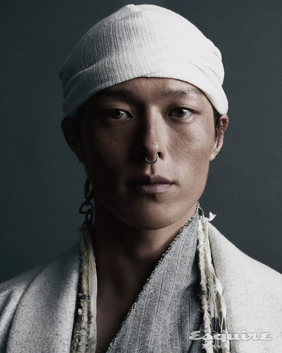 Photo shared by 장기용 on November 04, 2025 tagging @hongjanghyun, and @esquire.korea. May be a closeup of one or more people, makeup, headscarf, headdress, bandanna and text.