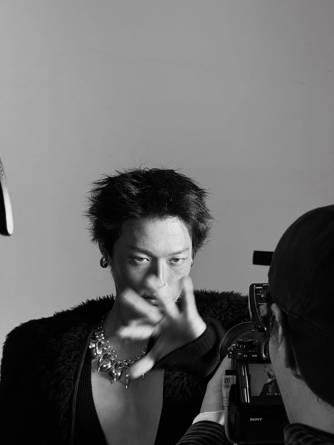 Photo by 장기용 on November 04, 2025. May be a black-and-white image of one or more people, makeup, hair, camera and text.