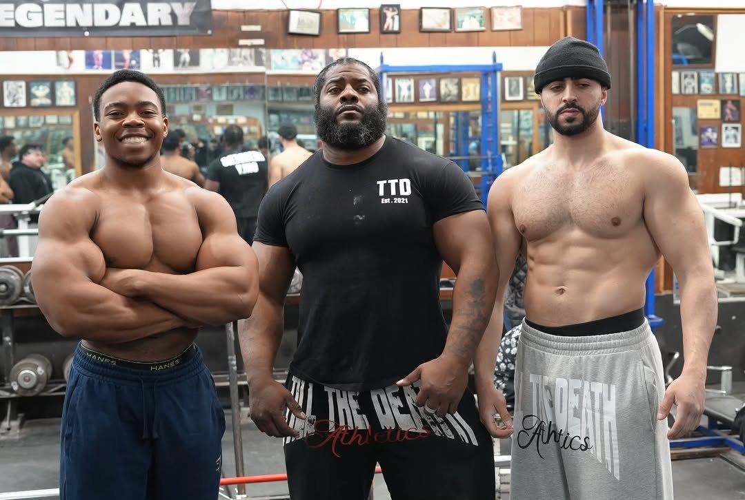 Photo shared by Julian Fitzgerald on February 02, 2026 tagging @haddy_abdel. May be an image of one or more people, beard, biceps, people bodybuilding, barbell and text that says 'GENDARY TTD Ext. 2821 IKE TEme DE JATH'.