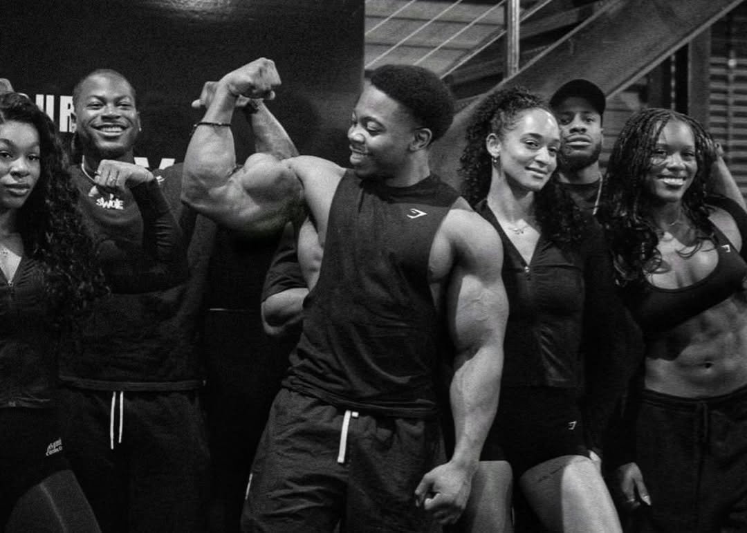 Photo by Julian Fitzgerald on February 17, 2026. May be a black-and-white image of one or more people, biceps, people bodybuilding, activewear, barbell, sportswear and text.