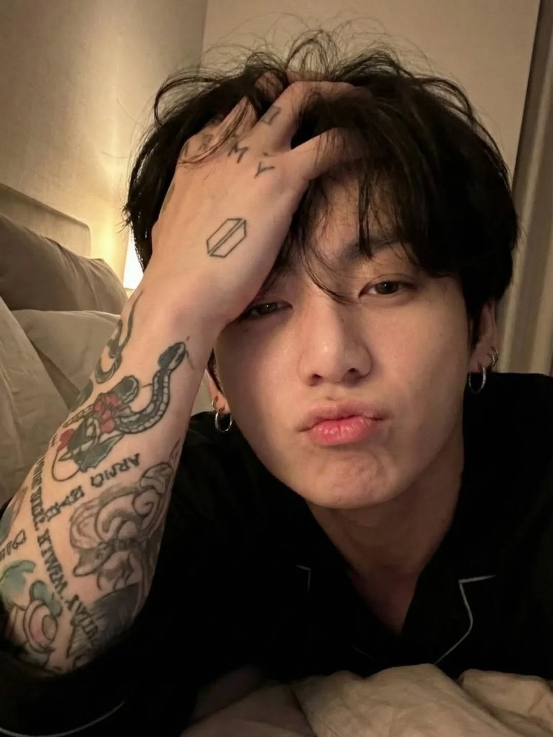 Photo by JUNGKOOK (전정국) Updates on February 03, 2026. May be an image of one or more people, bangs and text.