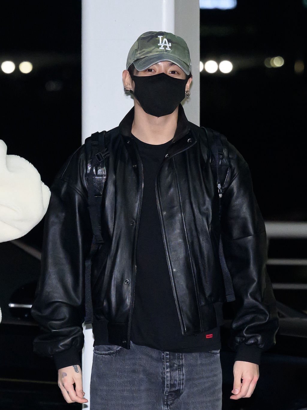 Photo by JUNGKOOK (전정국) Updates on February 11, 2026. May be an image of one or more people, bangs, top, bolo tie and text that says 'IA In ゴ T'.