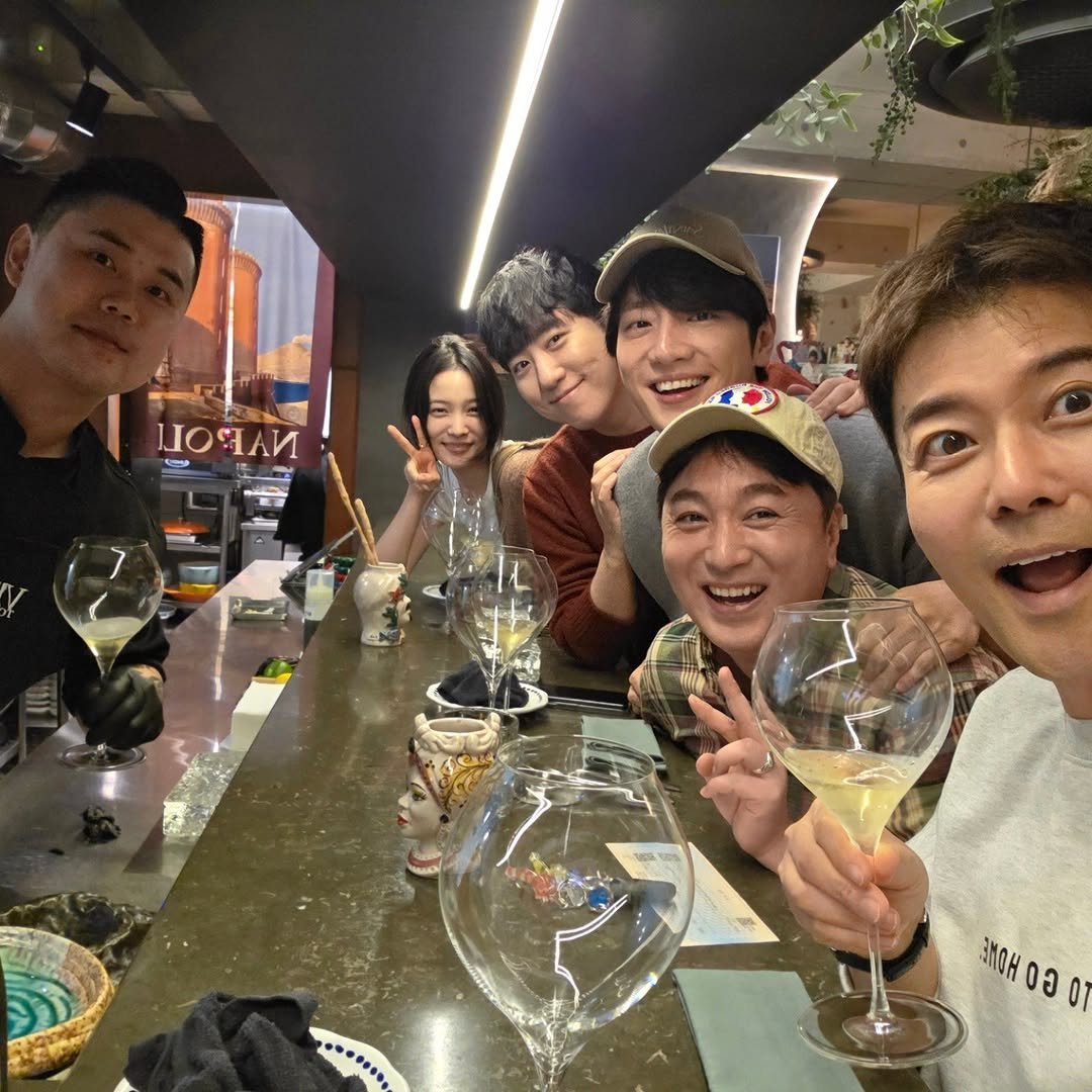 Photo shared by 전현무 on November 11, 2025 tagging @sangyeob, @sh_ovel_y, @orbit_scientist, @king__castle, and @napolimatfia. May be an image of one or more people, wine glass, alcohol, wine bottle and text.