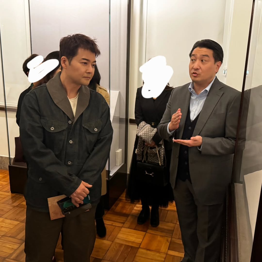 Photo by 전현무 on October 31, 2025. May be an image of one or more people, people standing, duffle coat, suit and text.