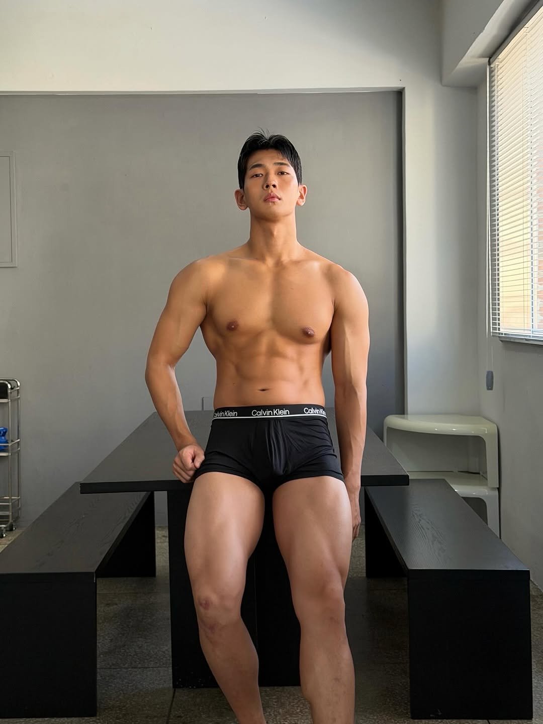 Photo shared by 이준한 on October 24, 2025 tagging @calvinklein. May be an image of one or more people, biceps, people bodybuilding and text.