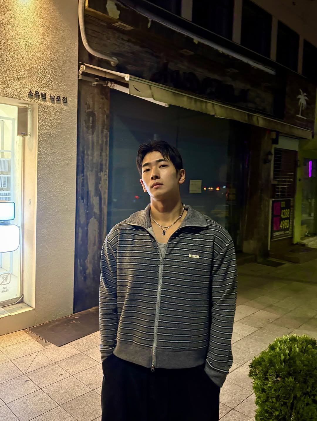 Photo shared by 이준한 on December 01, 2025 tagging @process__kr. May be an image of one or more people, duffle coat, parka, bolo tie, sweatpants and text.