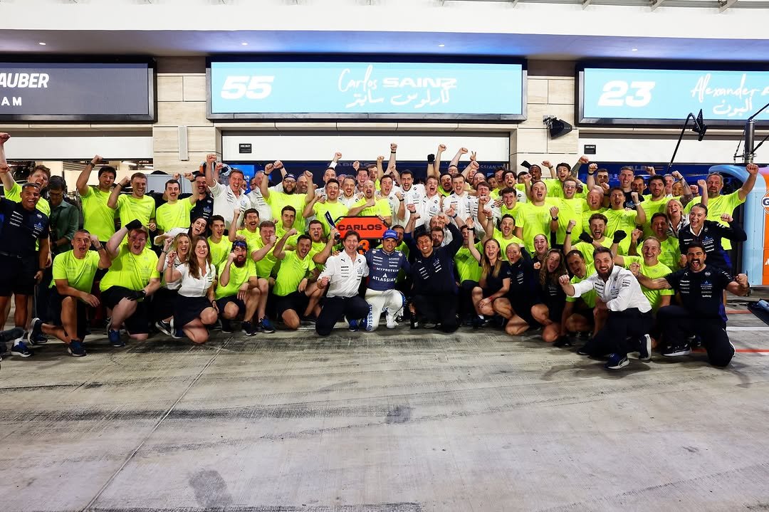 Photo shared by Atlassian Williams Racing on November 30, 2025 tagging @carlossainz55, @alex_albon, and @jv.f1. May be an image of ‎text that says '‎AUBER AM 55 Coke CLgNT SAINZ لارلرس 23 Acmander A اليون‎'‎.
