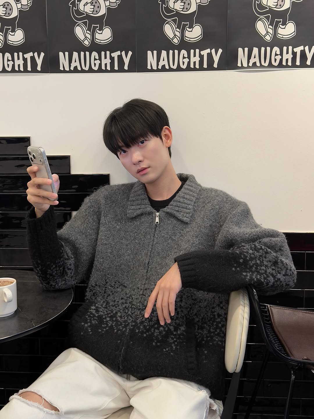 Photo shared by 백정훈 on November 10, 2025 tagging @defgarments. May be an image of sweater and text that says 'GHTY NAUGHTY NAUGHTY NAUGHTY'.