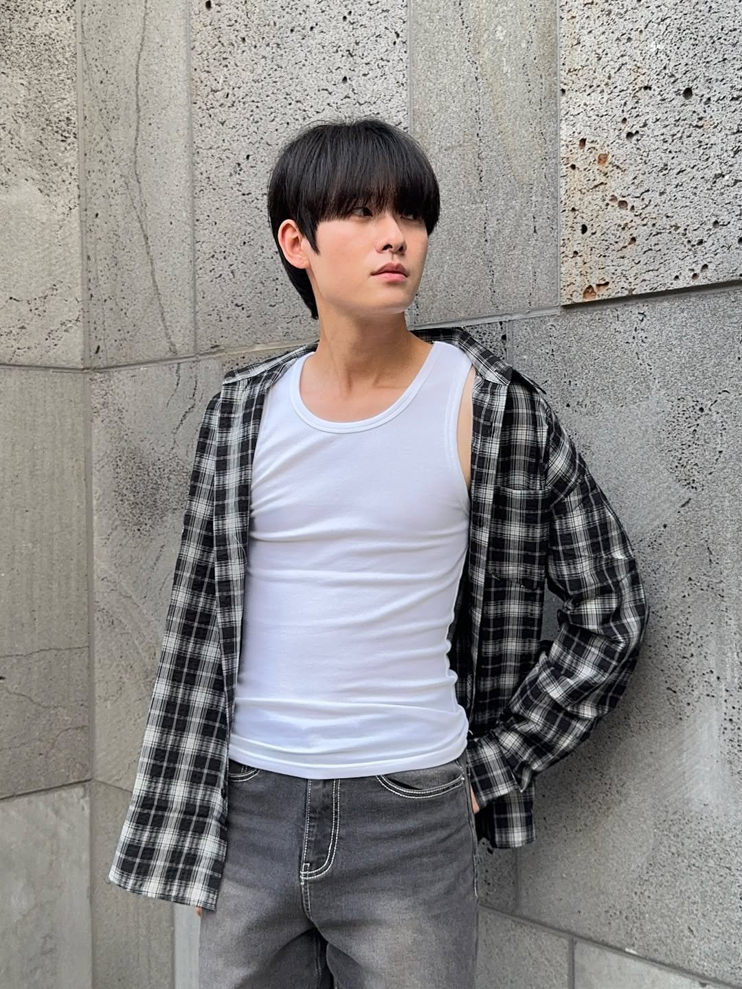 Photo shared by 백정훈 on September 12, 2025 tagging @hangten_korea. May be an image of 1 person, bangs, kilt, flannel, outerwear and text.
