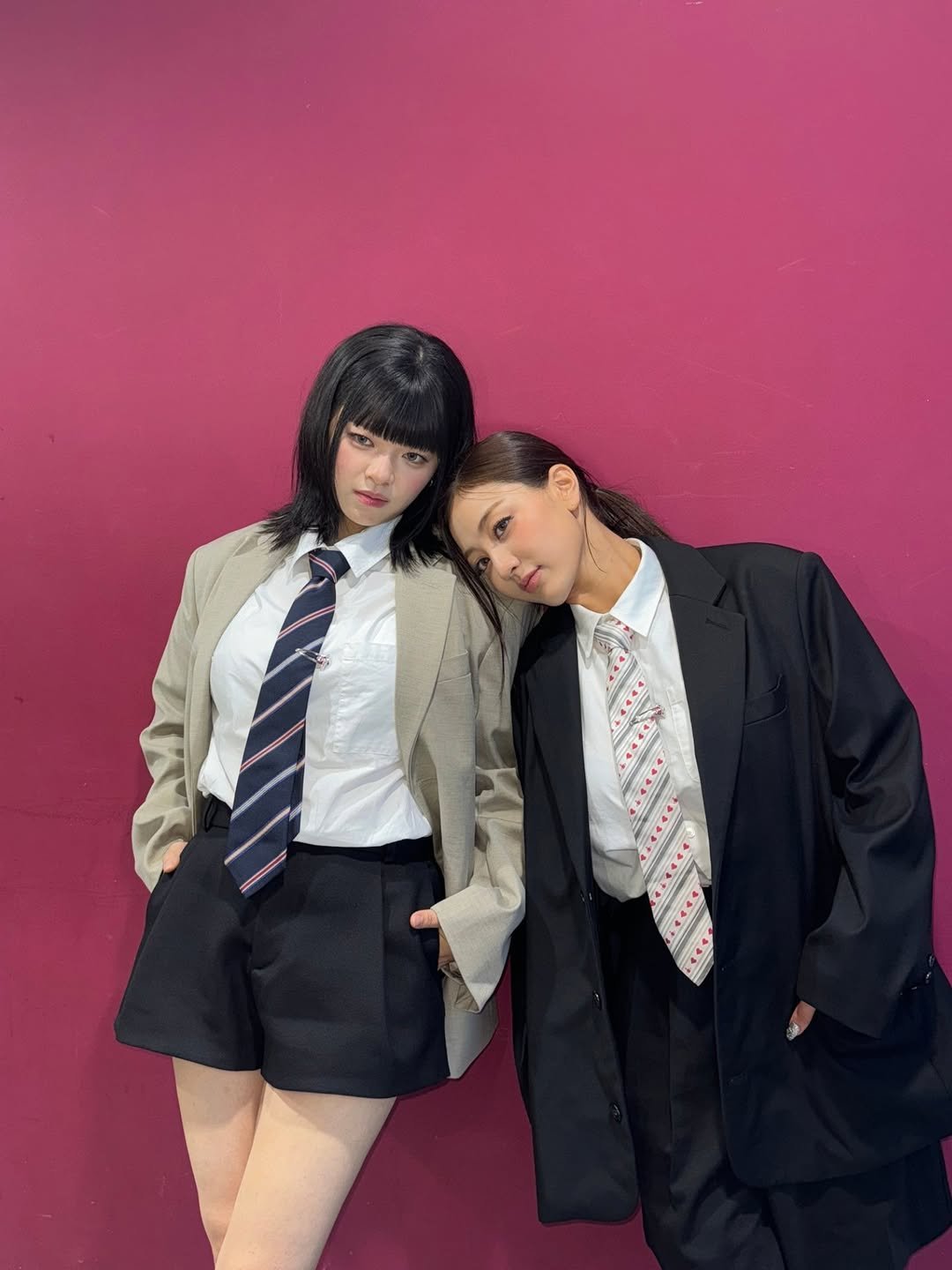 Photo shared by 정연 (JEONGYEON) on July 12, 2025 tagging @_zyozyo. May be an image of 2 people, duffle coat, suit, miniskirt and text.