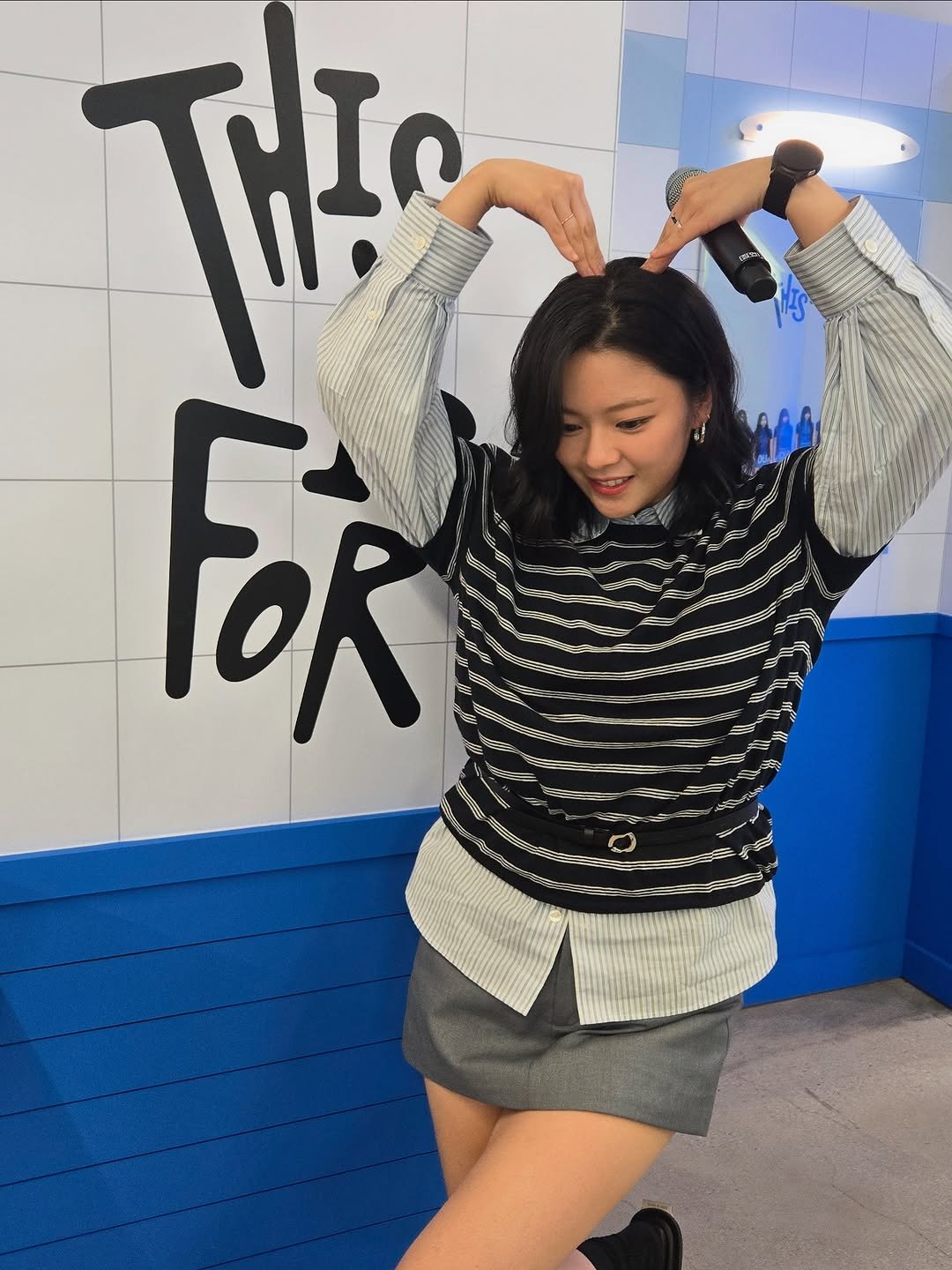 Photo by 정연 (JEONGYEON) on July 08, 2025. May be an image of 1 person, sweater, miniskirt, top, turtleneck and text.