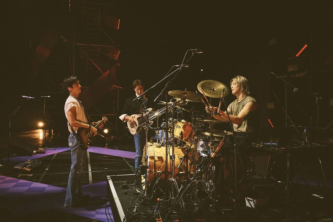 Photo shared by CNBLUE OFFICIAL on October 29, 2025 tagging @mr_kanggun, @leejungshin91, and @jyheffect0622. May be an image of cymbal, drum, drumstick, tambourine, concert and text.