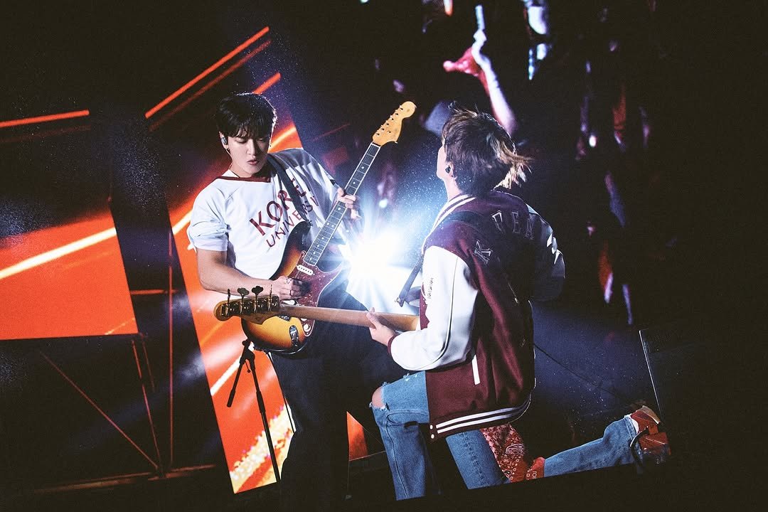 Photo shared by CNBLUE OFFICIAL on October 05, 2025 tagging @mr_kanggun, @leejungshin91, and @jyheffect0622. May be an image of 2 people, guitar, concert and text.