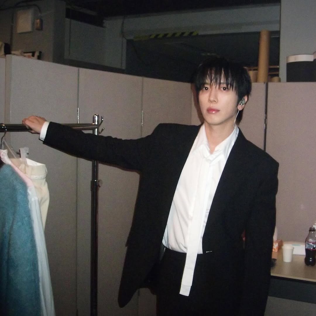 Photo by 정용화 on December 26, 2025. May be an image of one or more people, bangs, suit, bolo tie, blazer and text.