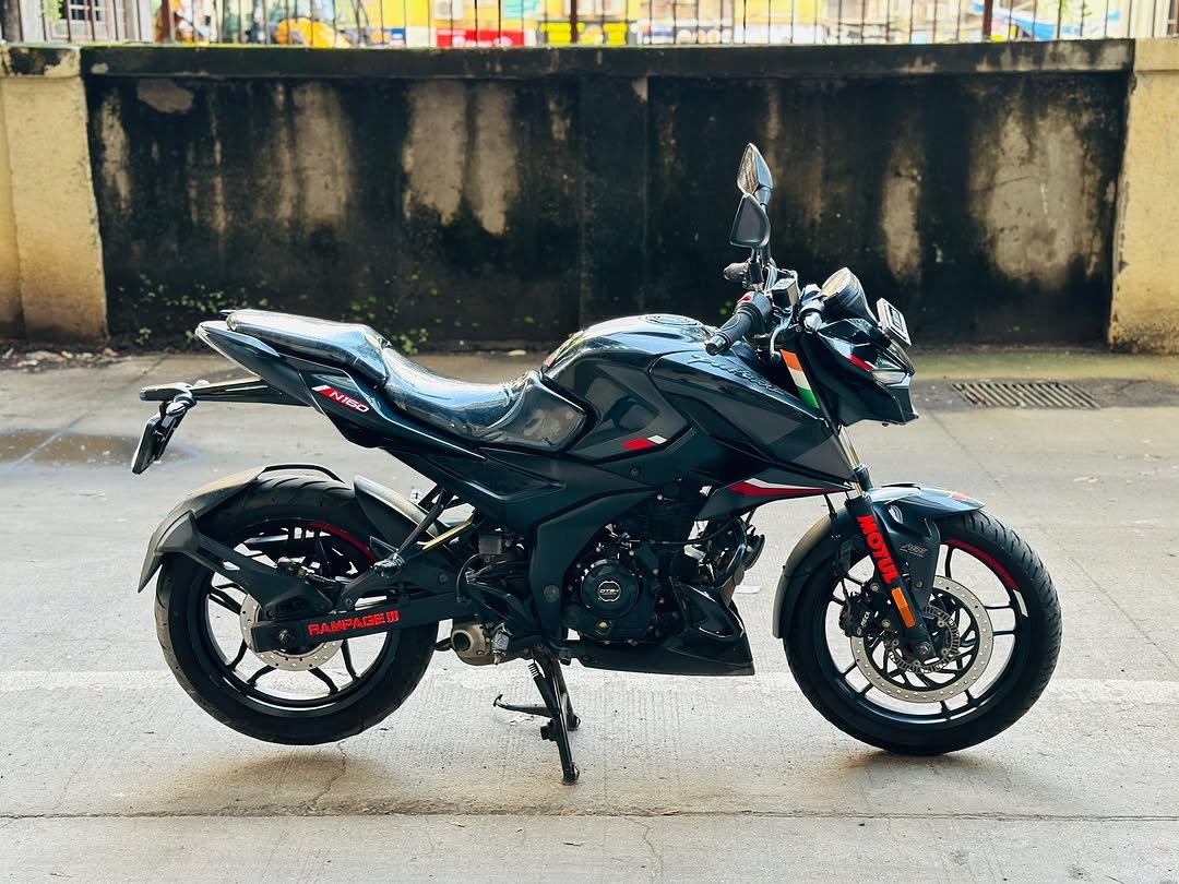 Photo shared by J.Y MOTORS on September 26, 2025 tagging @mypulsarofficial, @thewheelsshow_, @bike_o_beast, and @revwithabhi_. May be an image of ‎motorcycle, scooter, helmet and ‎text that says '‎NIO RAMPAGEM RAMPA MOTUL و‎'‎‎.