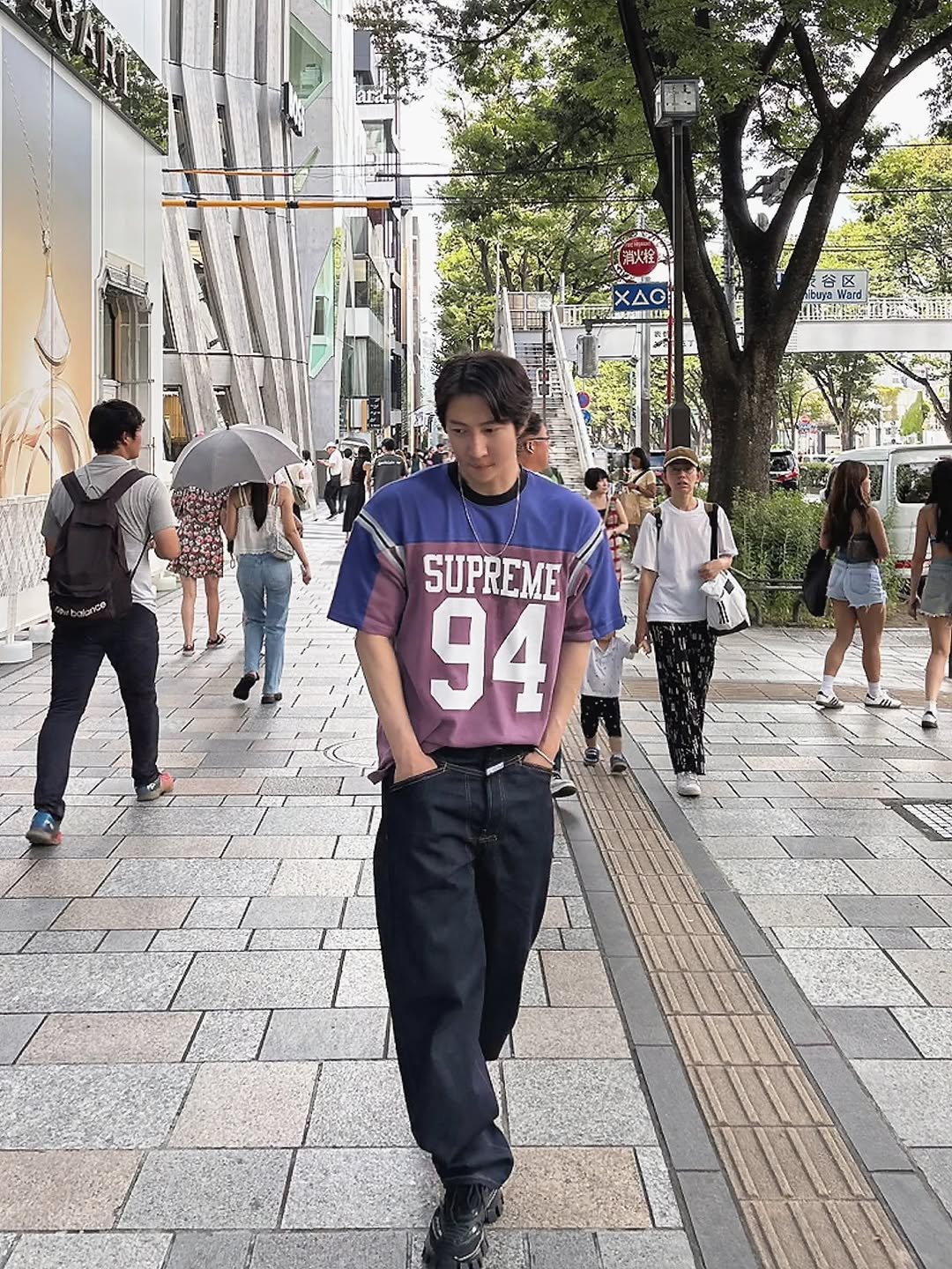 Photo by DH_K on July 31, 2025. May be an image of 8 people, duffle coat, street and text.