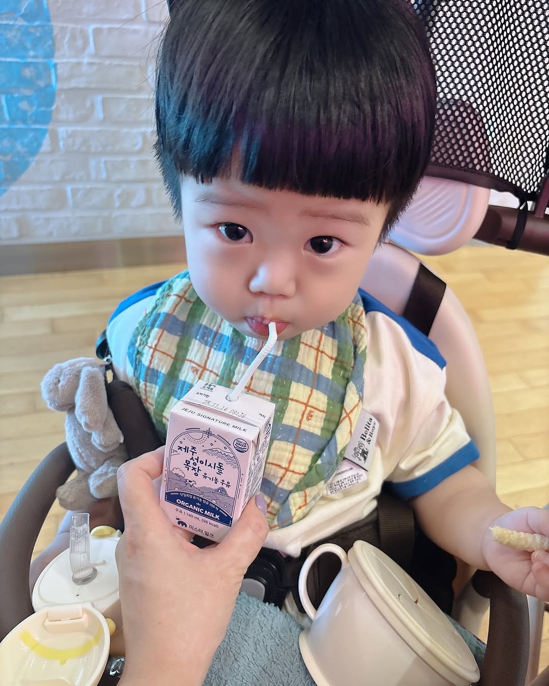 Photo by 은총 | 의진이네 🏡 on August 31, 2025. May be an image of 1 person, baby, diaper, milk, smoothie, doll, juice, chocolate milk and text.