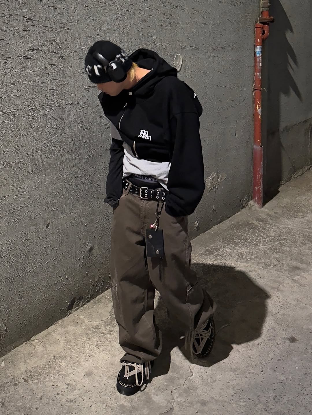 Photo shared by かぜ on March 25, 2026 tagging @indust_seoul. May be an image of duffle coat, face mask, sweatpants, gas mask, parka, glasses and text.