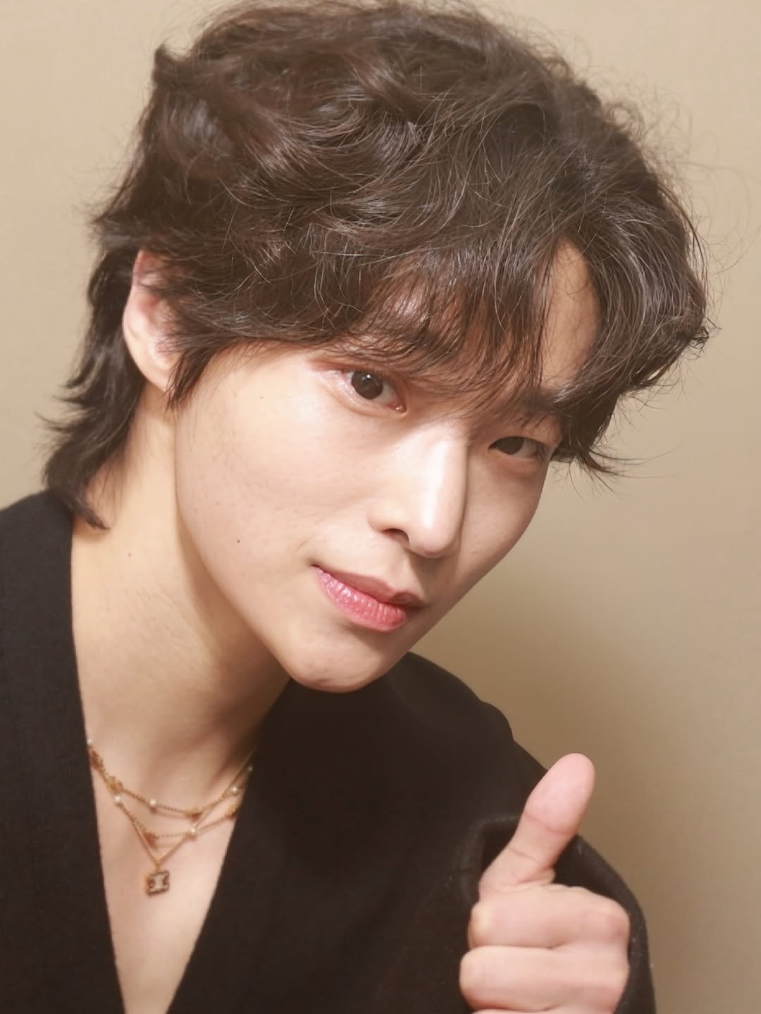 Photo by 간현배 on December 31, 2025. May be an image of one or more people, bangs, bolo tie and text.