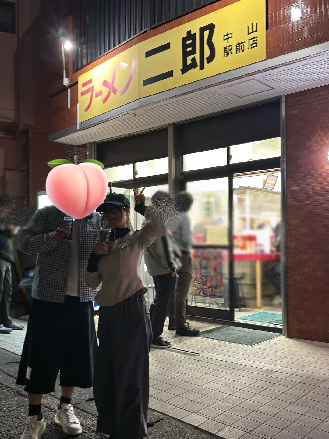 Photo by 桃乃木かな on April 23, 2026. May be an image of one or more people, signboard and text.