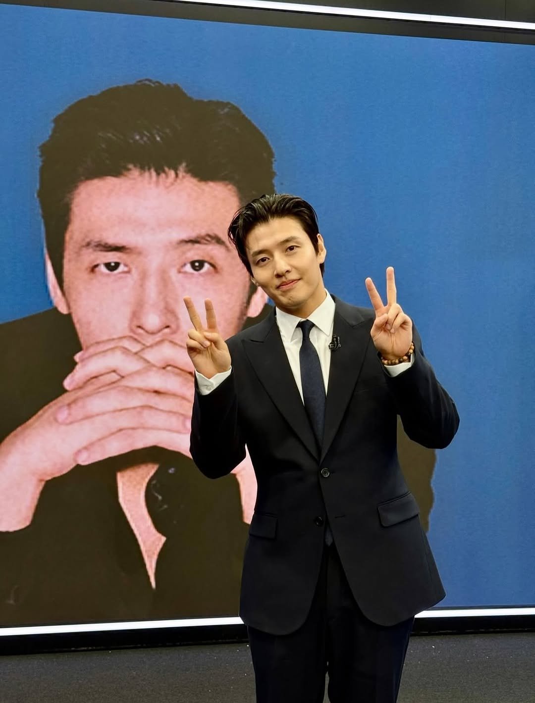 Photo by Kang Neul on October 18, 2025. May be an image of one or more people, suit, blazer, dinner jacket and text.