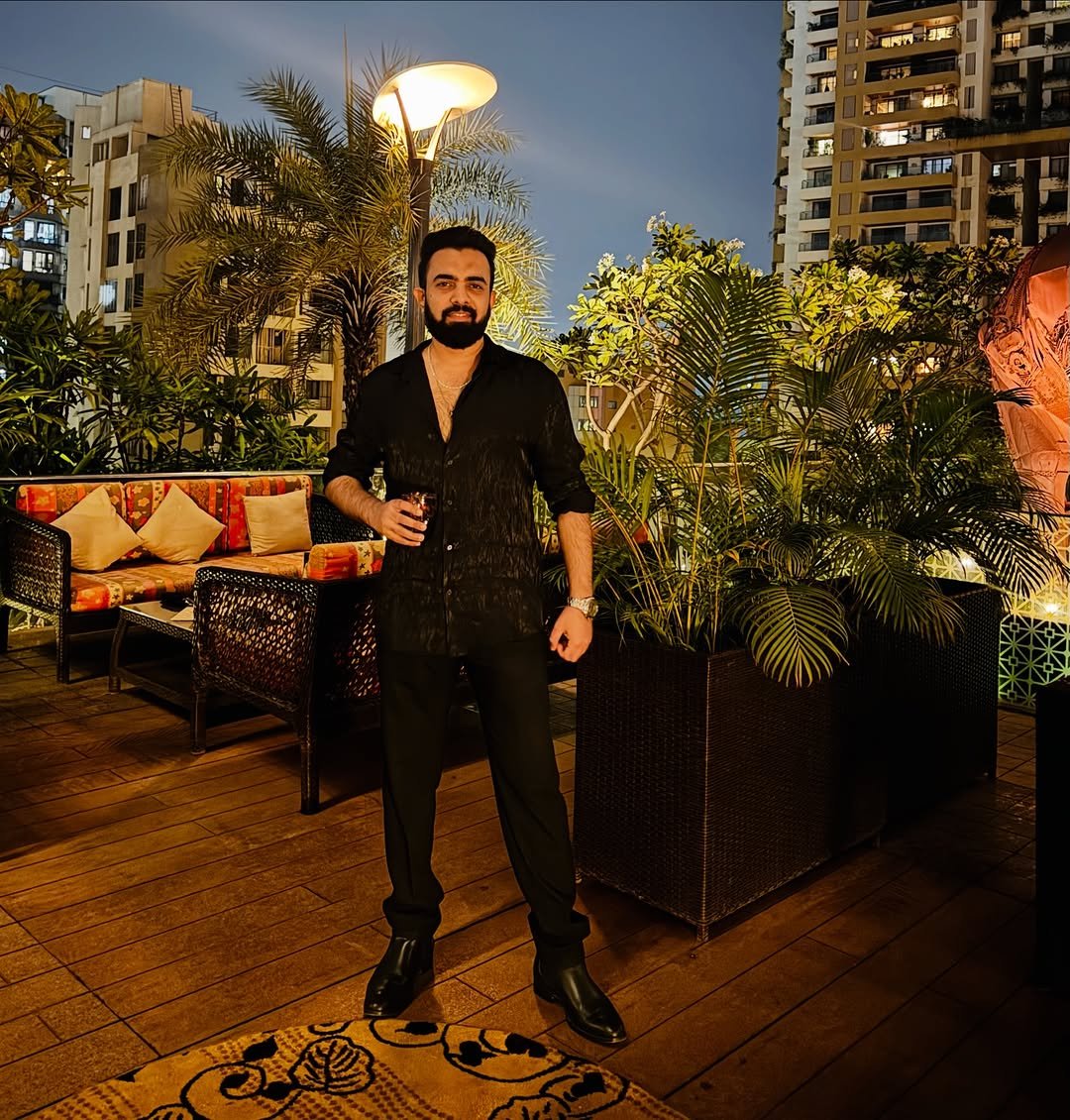 Photo by Kasim Dhamaskar on November 27, 2025. May be an image of one or more people, beard, cigar, bolo tie, outdoors and text.