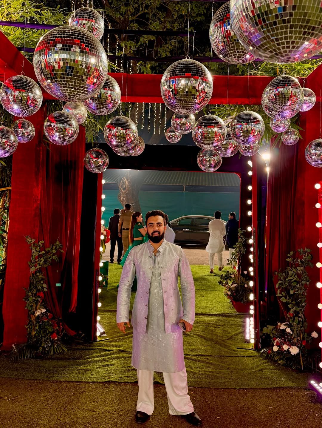 Photo by Kasim Dhamaskar on December 01, 2025. May be an image of overcoat, tinsel, bath robe and text.