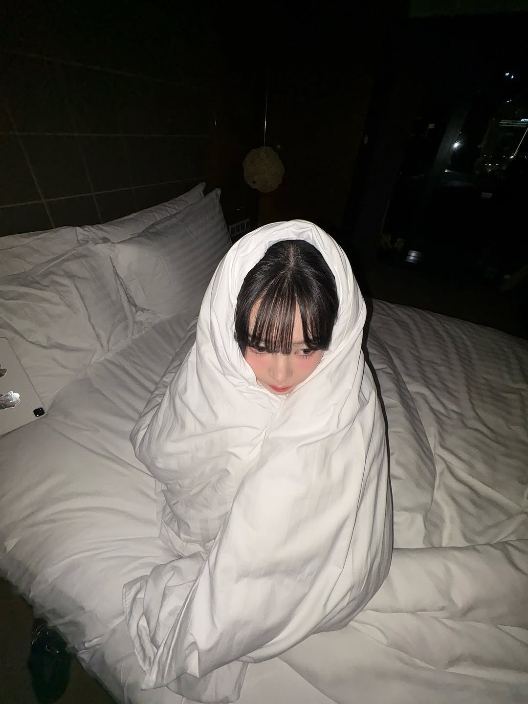 Photo by KARINA on September 27, 2025. May be an image of bed, blanket, bath robe, bedroom and text.