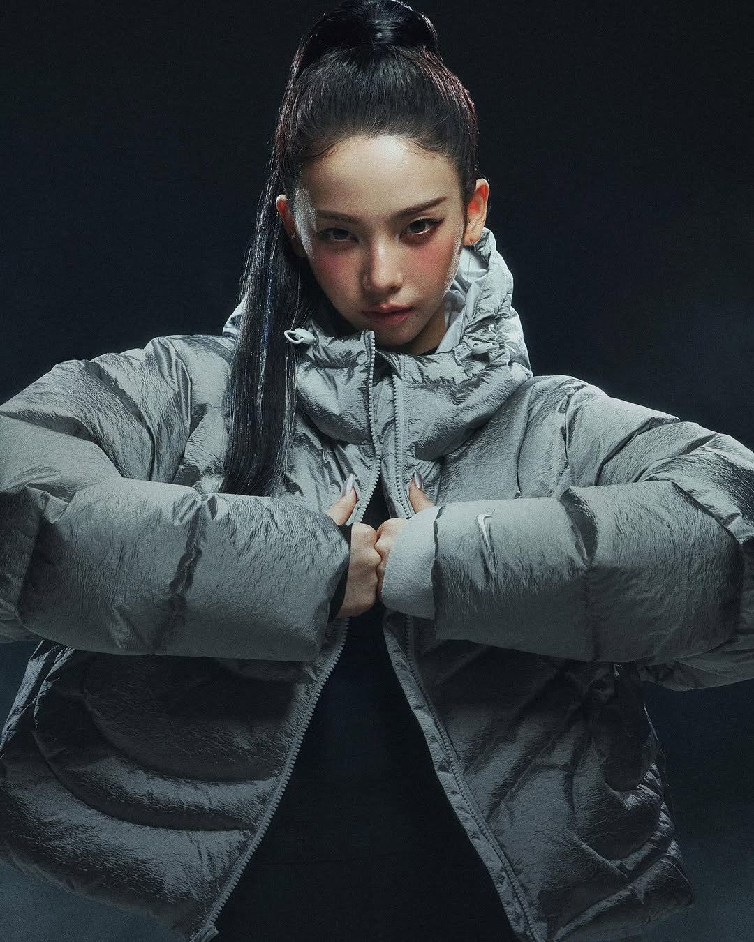 Photo shared by Nike Seoul on October 16, 2025 tagging @katarinabluu. May be an image of one or more people, braids, duffle coat, goosedown coat, parka and text.