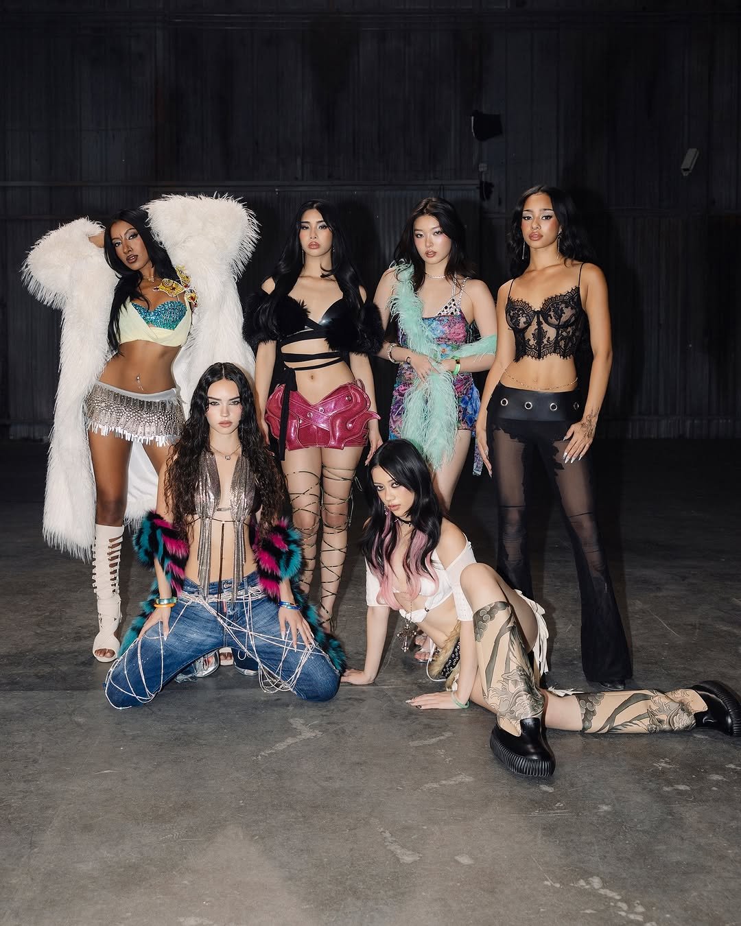 Photo by KATSEYE on November 27, 2025. May be an image of dancing, fishnet stockings, headdress and text.