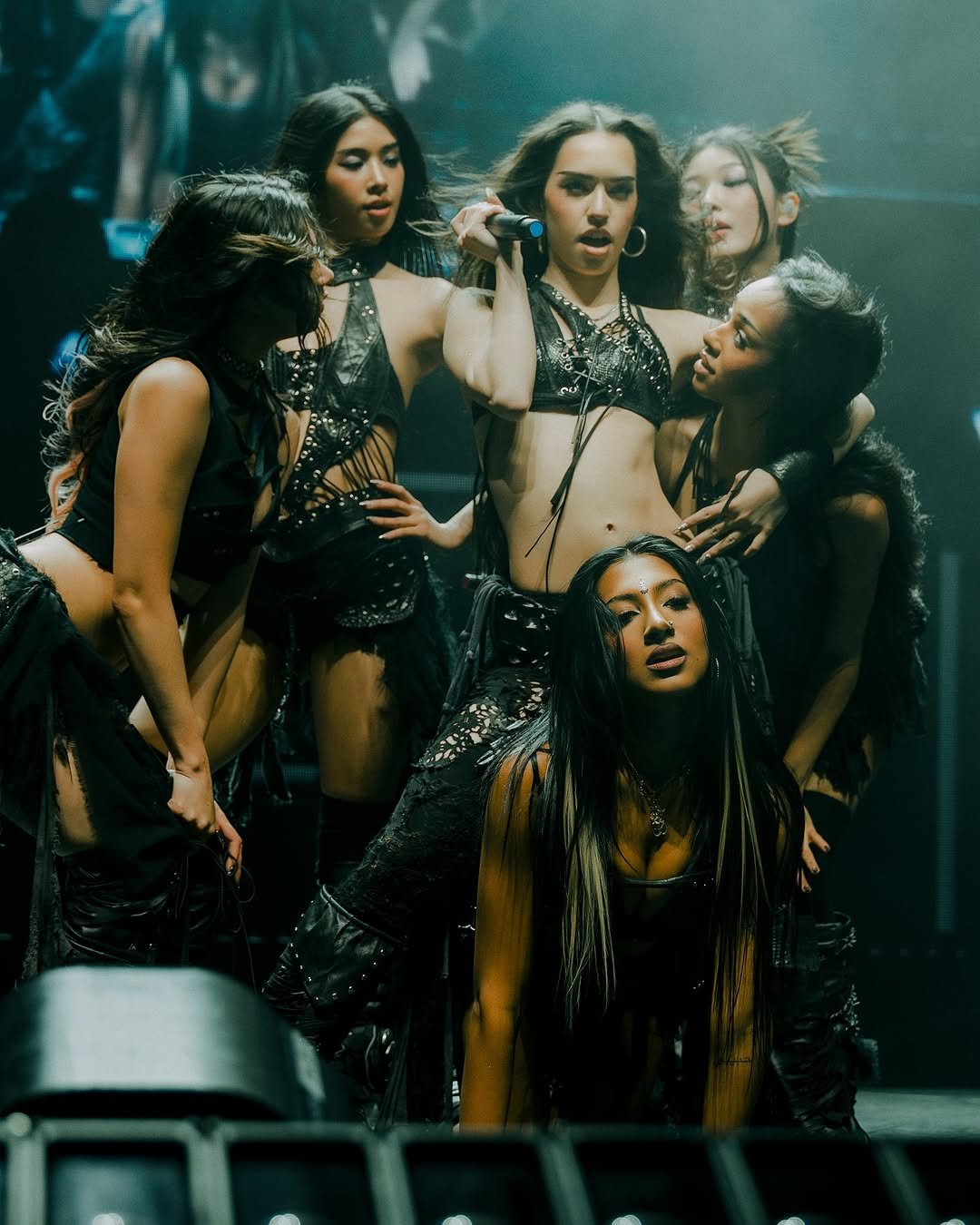 Photo by KATSEYE on November 30, 2025. May be an image of dancing, fishnet stockings, poster and text.