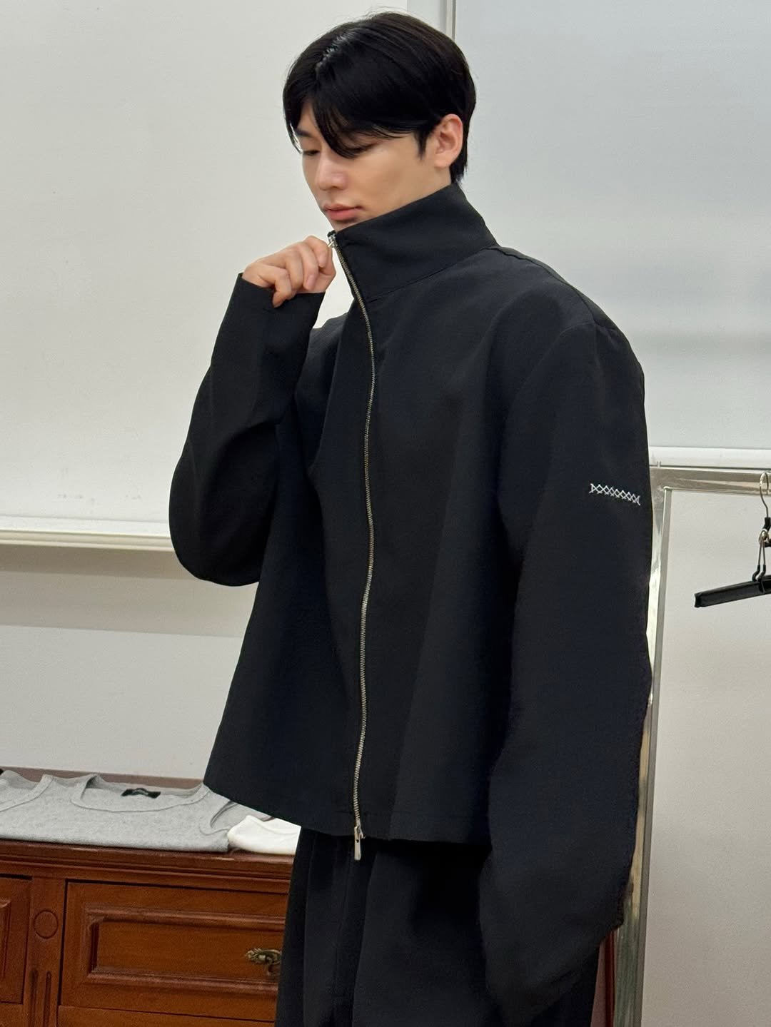 Photo shared by 은상원 on September 01, 2025 tagging @junne_official. May be an image of 1 person, duffle coat, overcoat, turtleneck and text.
