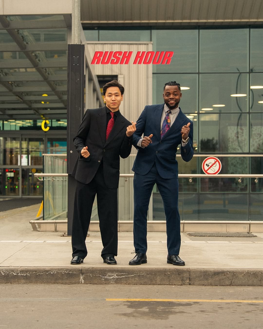 Photo shared by K. Beklan on December 03, 2025 tagging @aji_naiman. May be an image of one or more people, people standing, suit and text that says 'RUSH RUSHHOUR HOUR የንል'.