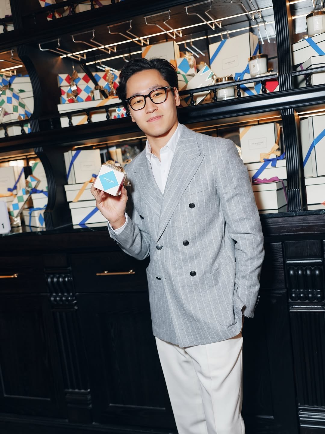 Photo shared by K. Beklan on December 10, 2025 tagging @von__rou, and @jomalonelondon. May be an image of overcoat, duffle coat, wingtip shoes, eyewear, suit, bolo tie, dinner jacket, blazer and text.