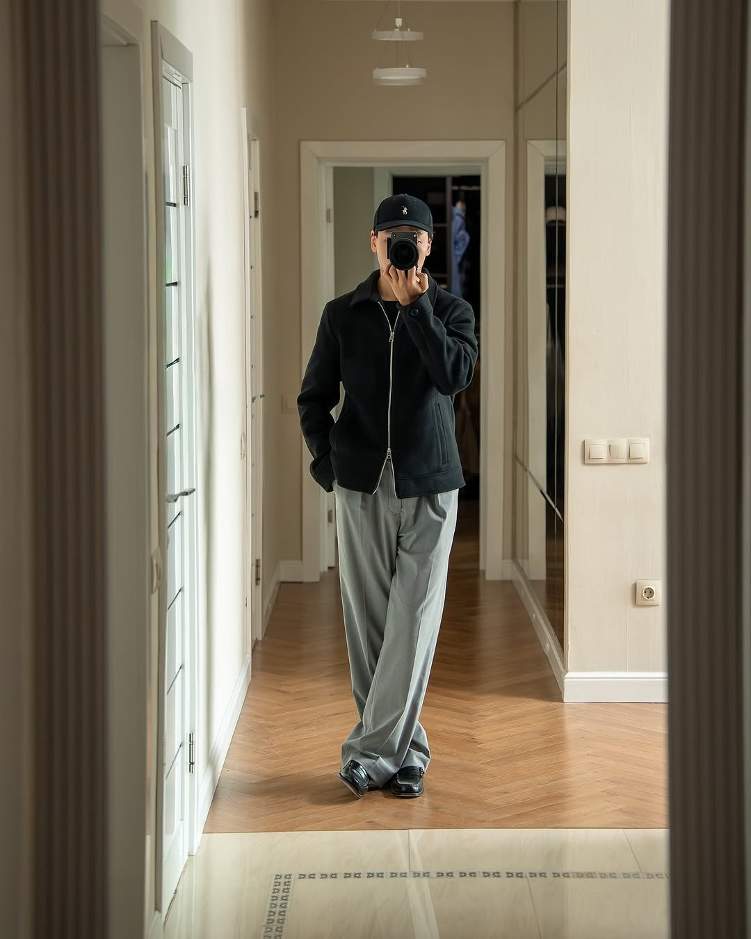 Photo by K. Beklan on October 25, 2025. May be an image of sweatpants, mirror, hallway and text.