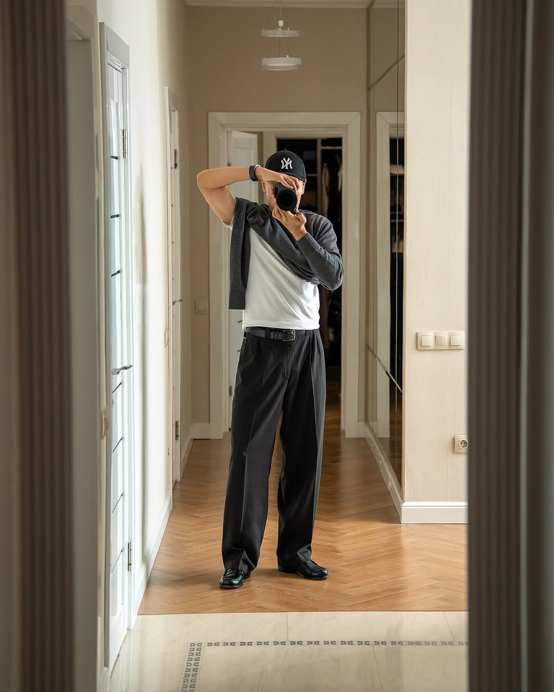 Photo by K. Beklan on September 18, 2025. May be an image of 1 person, golfing, standing, hallway and text.