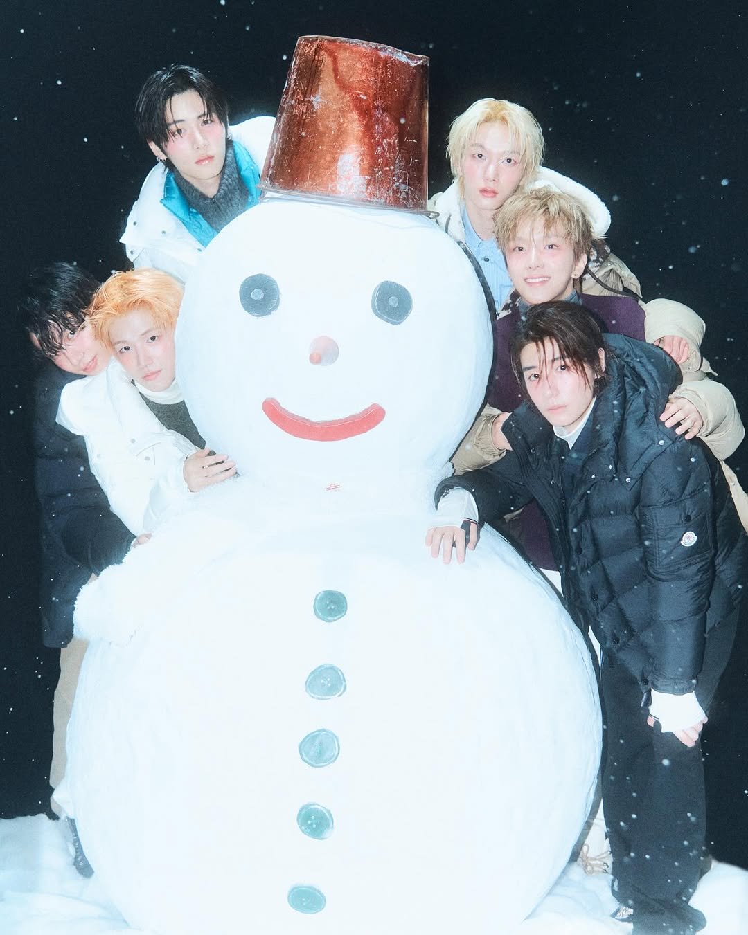 Photo shared by 김신애 on November 26, 2025 tagging @hbhan_, @dazedkorea, and @boynextdoor_official. May be an image of one or more people, bangs, snowman and text.