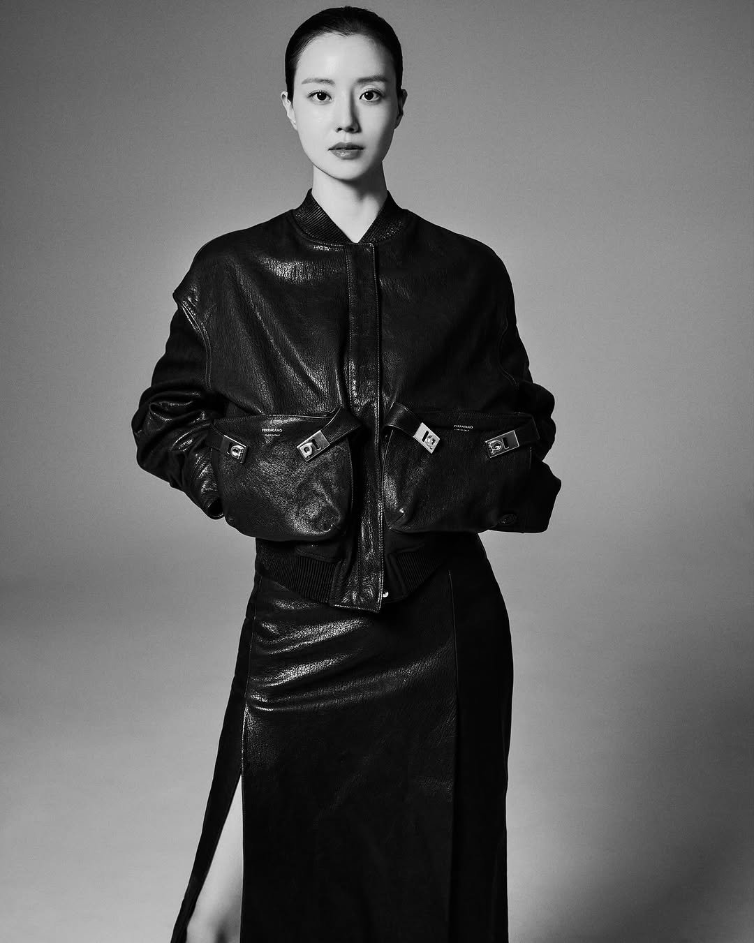 Photo shared by 김신애 on November 18, 2025 tagging @wkorea, @xyjgk, and @moonchaewon_official. May be a black-and-white image of one or more people, makeup, overcoat and text.