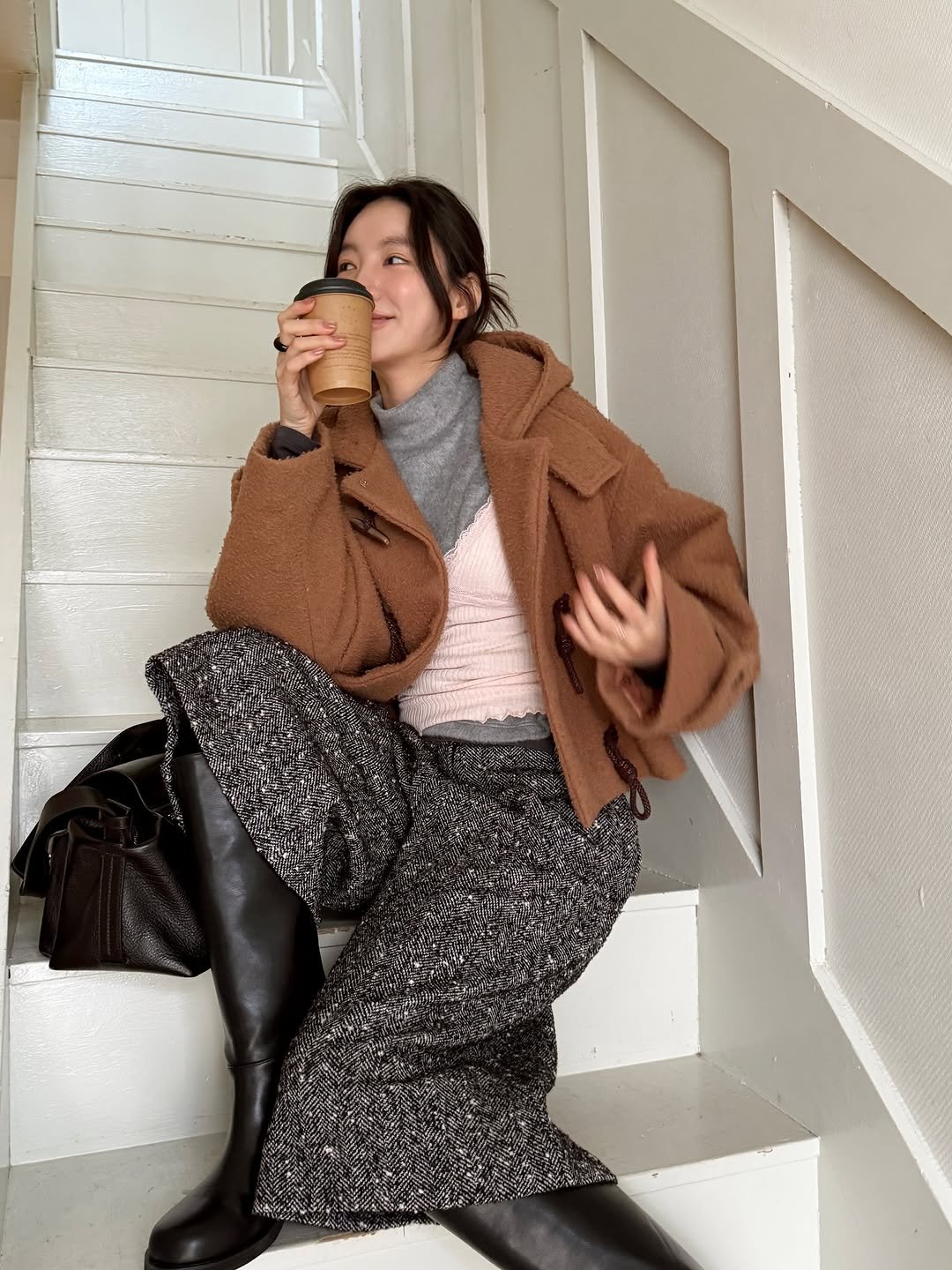 Photo by 김지혜 on December 29, 2025. May be an image of overcoat, turtleneck and text.