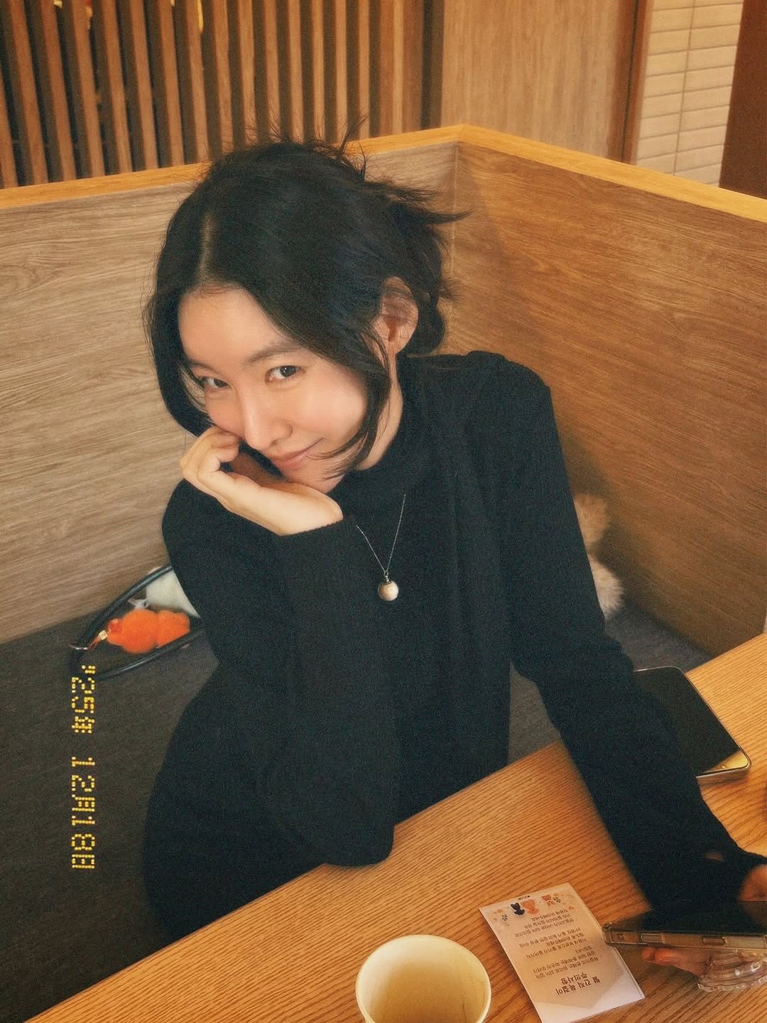 Photo by 김지혜 on December 22, 2025. May be an image of one or more people, hair, duffle coat and text.