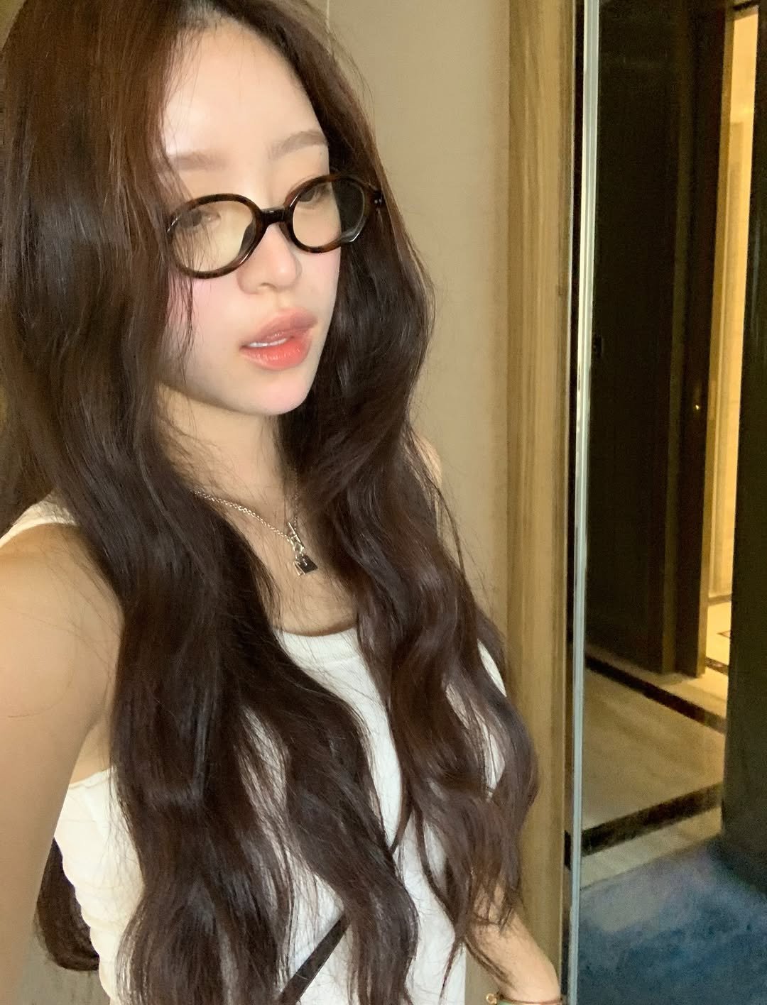 Photo by kend 켄드 on August 08, 2025. May be a selfie of 1 person, long hair, eyeglasses, mirror and text.