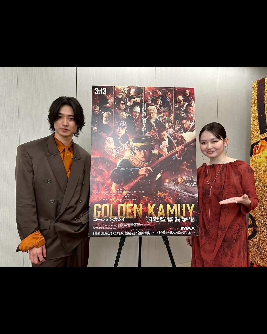 Photo shared by 山﨑賢人 on March 14, 2026 tagging @anna_yamada_, and @kamuy_movie. May be an image of suit, bolo tie, magazine, poster, blazer and text.