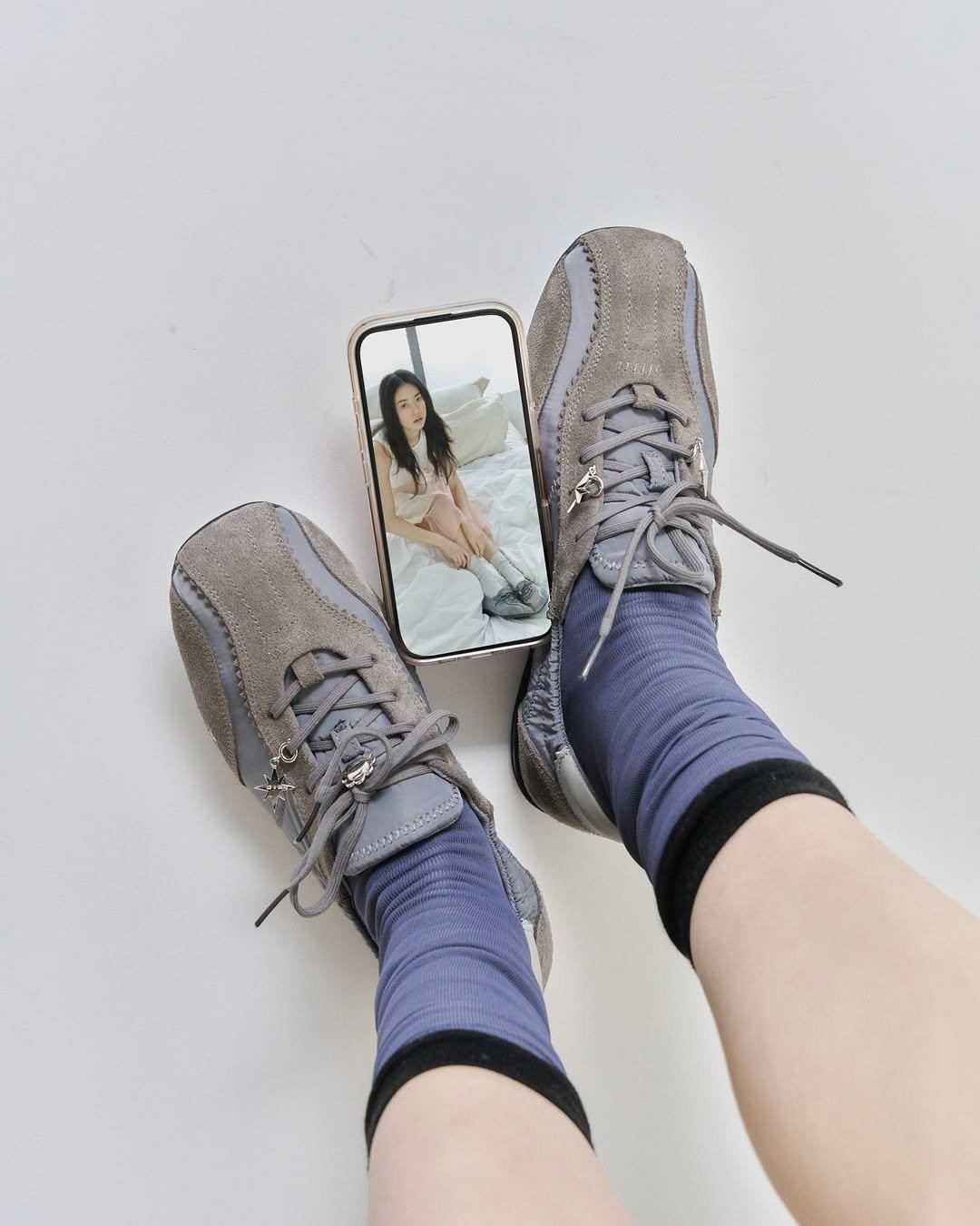 Photo by KHIHO on March 25, 2026. May be an image of sock, boots, tights and text.